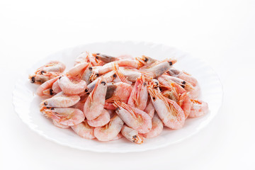 Pile of frozen shrimps on plate