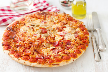 pizza on white wooden background