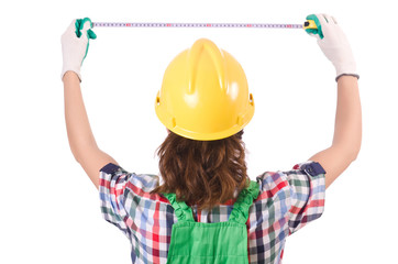 Female workman in green overalls isolated on white