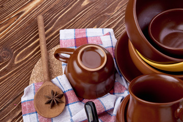 plates and cups on wooden table
