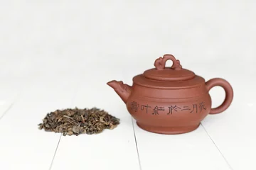 Foto op Aluminium Chinese teapot and pile of green tea © photopixel