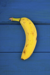 Banana on a background of the old wooden planks painted..