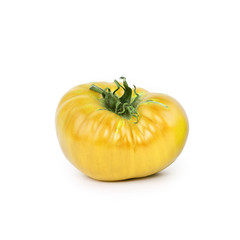 Yellow tomato on white