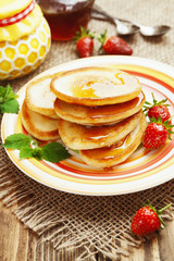 Homemade pancake with honey and strawberry