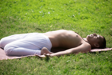 Reclining Hero Pose in park