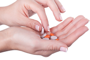 Taking pill from hand