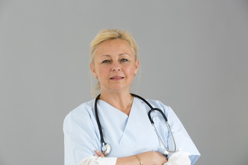 Close up portrait of female medical specialist standing and looking at the camera