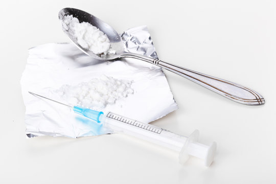 Syringe and cocaine on foil