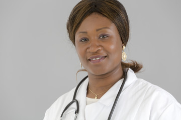 Close up portrait of attractive black female medical specialist looking at the camera