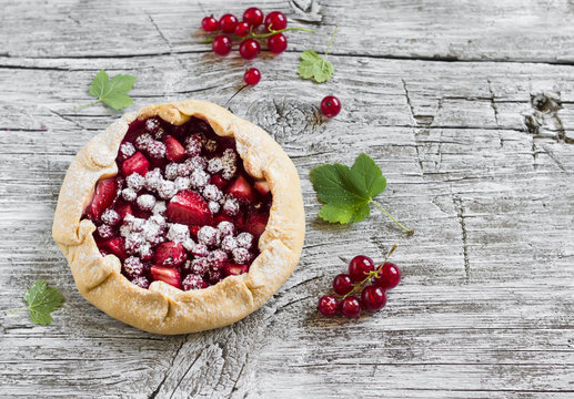 berry pie on a light wooden background