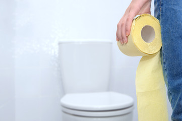 Close-up of woman on toilet .