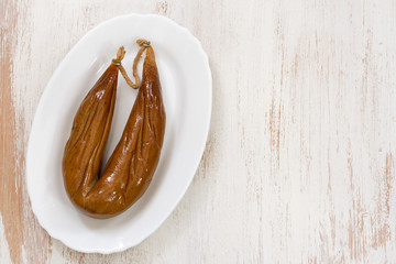 farinheira on white dish on white wooden background