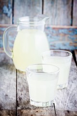 citrus cold homemade lemonade on wooden table