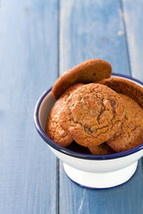 cookies in bowl on blue wooden background