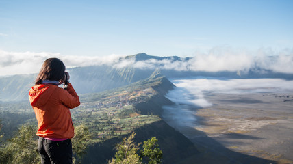 Traveller taking a picture of Cemoro Lawang