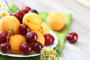 Fototapeta na wymiar Dish of fresh fruit in summer
