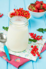 Yogurt in a glass jar with berries