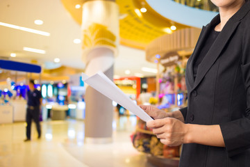 Businesswoman reading a business document.