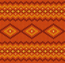 Knitted seamless pattern in red and orange colors