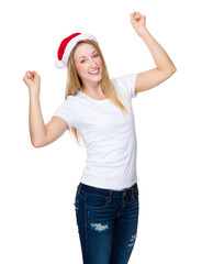 Obraz na płótnie Canvas Woman with red christmas hat raised hand up