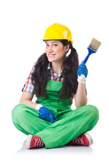 Female workman in green overalls isolated on white