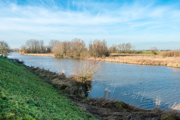 Banks of a small river in wintertime