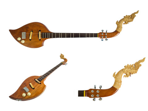 Thai musical instruments, Electric wooden pin with the great Naga head Isolated on white background. Clipping path.