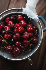 Sweet cherries in a strainer, high angle view, close-up