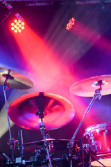 drum kit under stage spotlights