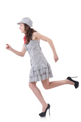 Young woman in gray striped dress isolated on white