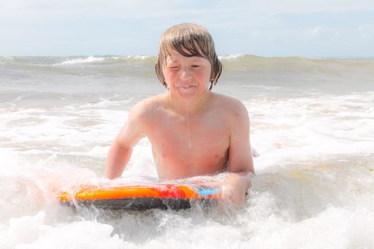 young bodyboarder after a wipeout