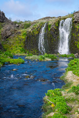 Naklejka na ściany i meble Waterfall in the Gjain gorge in Iceland
