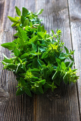 bunch of raw green herb marjoram