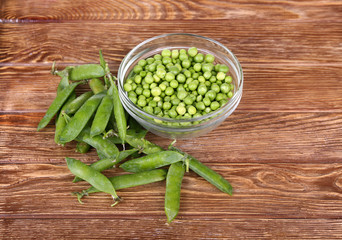 peas on a wooden bowl in a glass