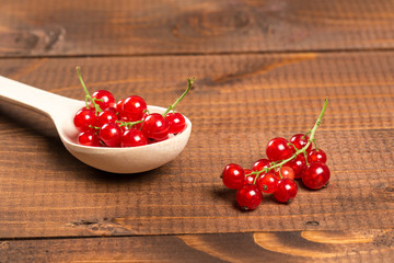 Red Currant On Brown Wooden Table