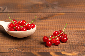 Red Currant On Brown Wooden Table