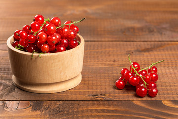 Red Currant On Brown Wooden Table
