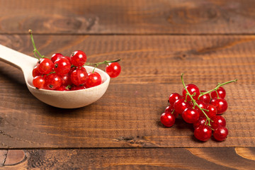 Red Currant On Brown Wooden Table