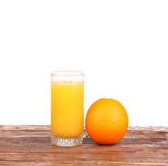 Fresh orange juice on the wood background