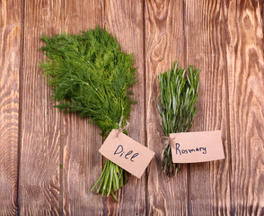Different fresh herbs on wooden background