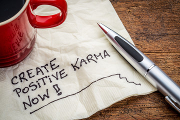 create positive karma - text on napkin - obrazy, fototapety, plakaty