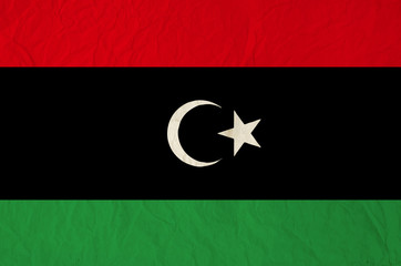 Flag of Libya with old vintage paper texture background