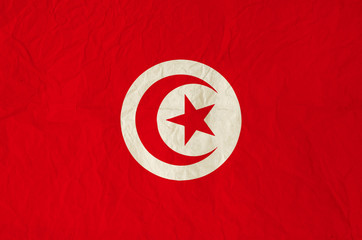 Flag of Tunisia with old vintage paper texture background