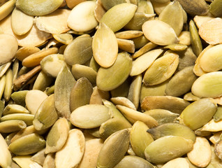 pumpkin seeds as a background. close