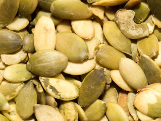 pumpkin seeds as a background. close