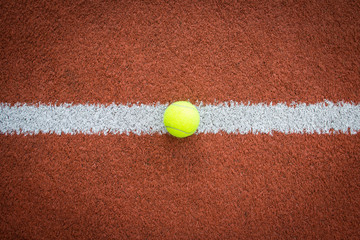 Tennis ball on line of court
