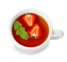 Cup of tea with mint and strawberries isolated on white