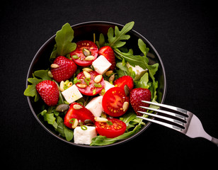 Strawberry tomato salad with feta cheese, olive oil