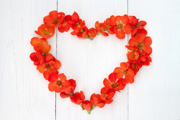 Flower heart on vintage wooden background. Valentin day or wedding concept