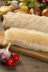 salted codfish on the wooden table with ingredients